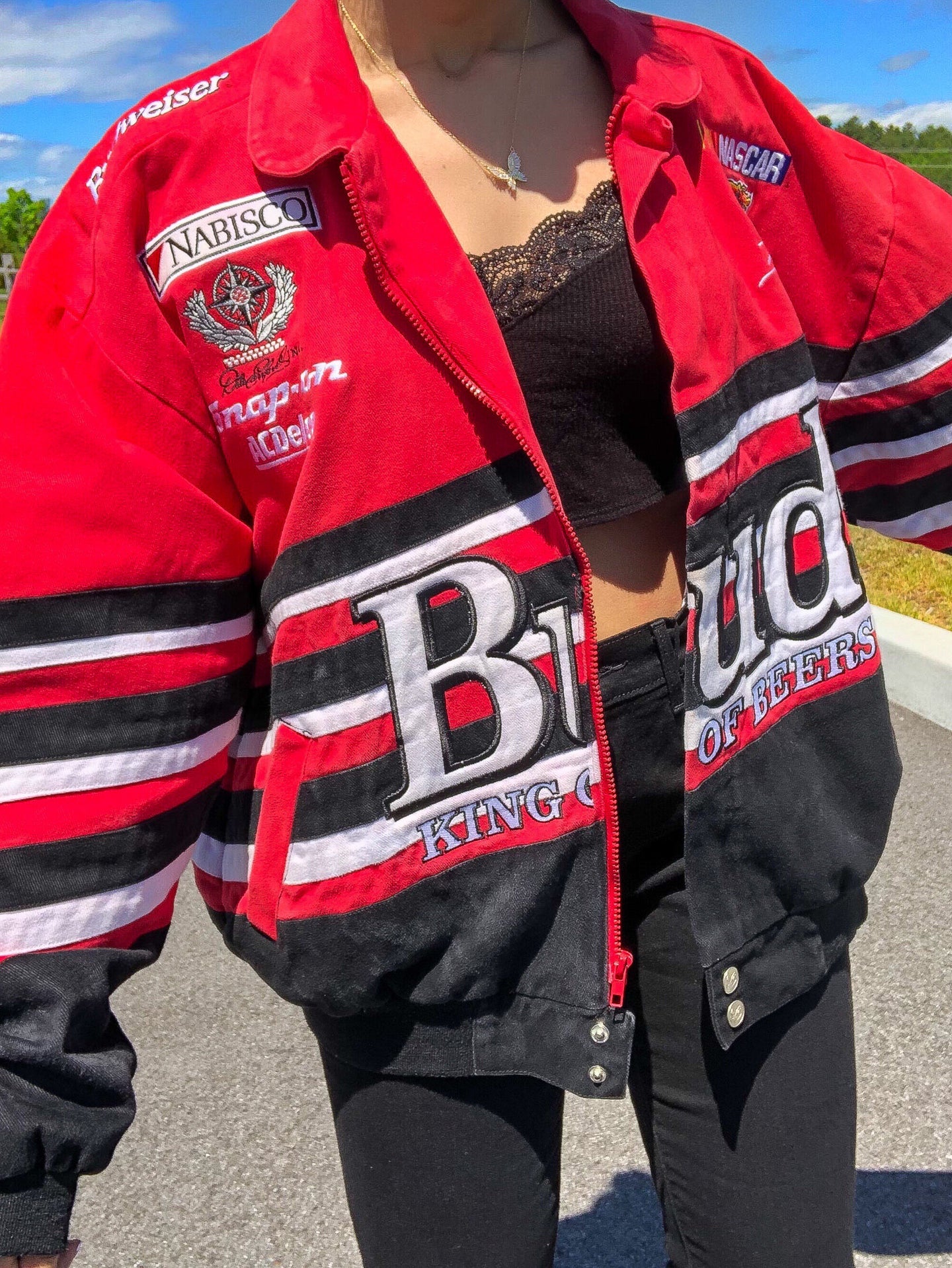 red and white striped nascar budweiser jacket oversized black jeans outfit lace tank top girl women's clothing fashion